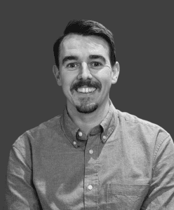 Black and white headshot of Sam