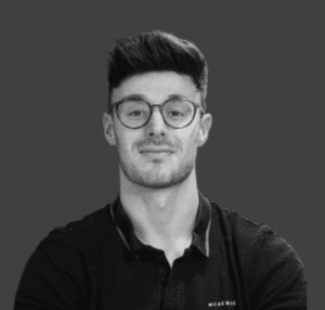 Black and white headshot of Tom
